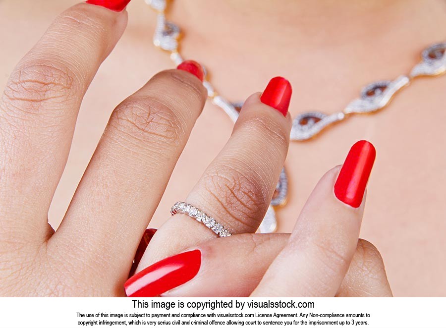 Woman Putting Diamond Ring Jewellery Part Of