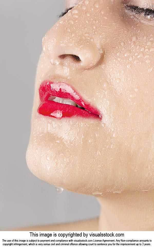 cute model Woman wet water drops falling face