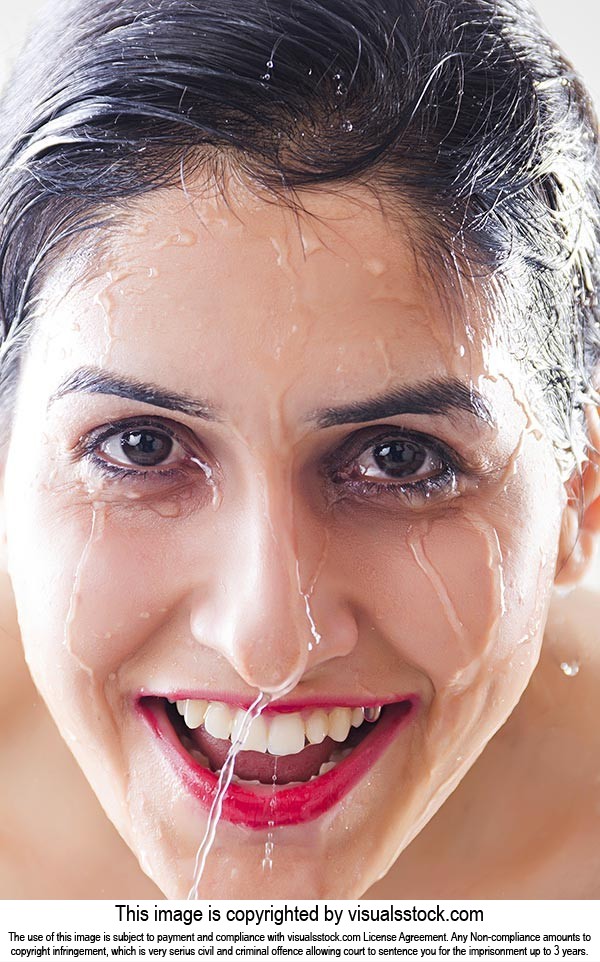 Close-up Beautiful wet woman face water drop