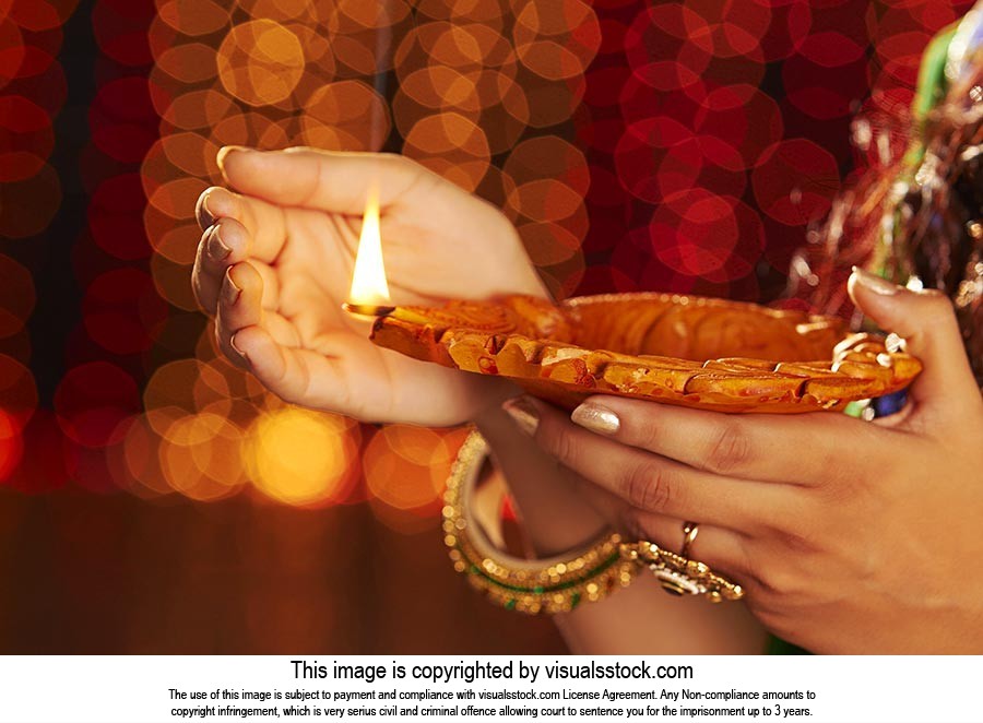 Woman Hand Holding Diya Deepavali