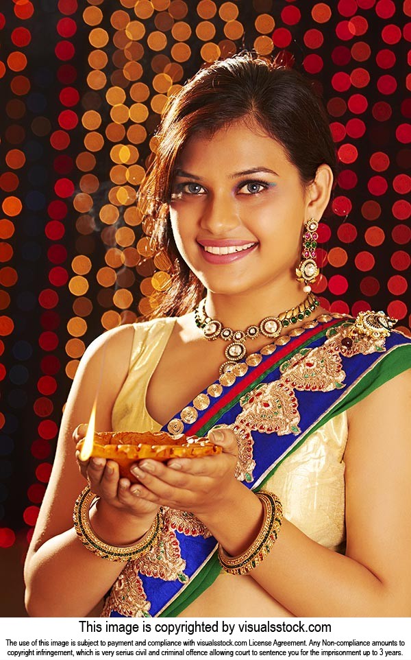 Lady Holding Diya Celebrating Diwali