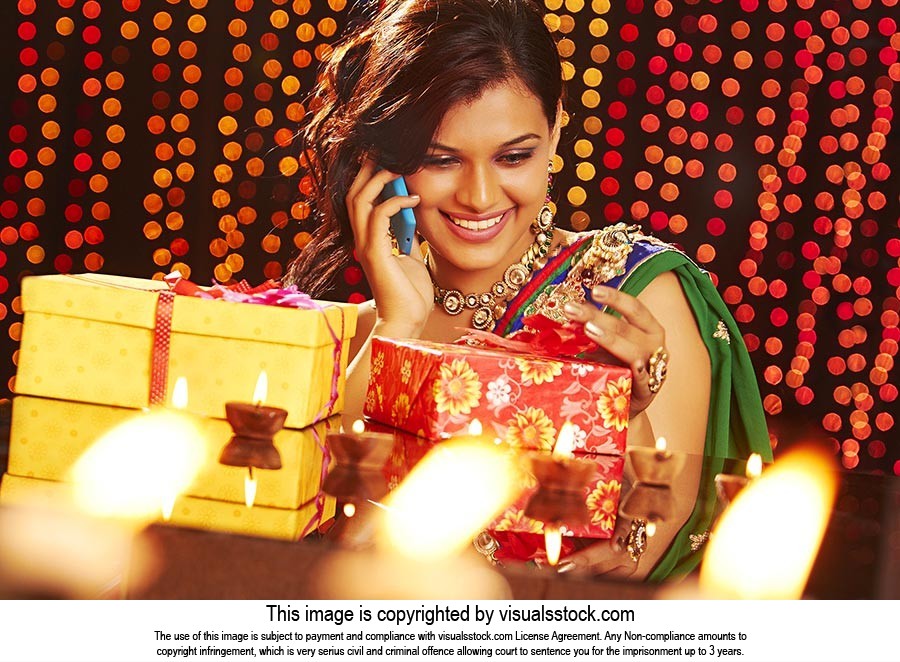 Woman Diwali Gift Taking Phone