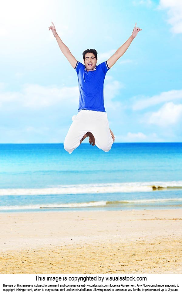 1 Person Only ; 20-25 Years ; Arms Raised ; Beach 