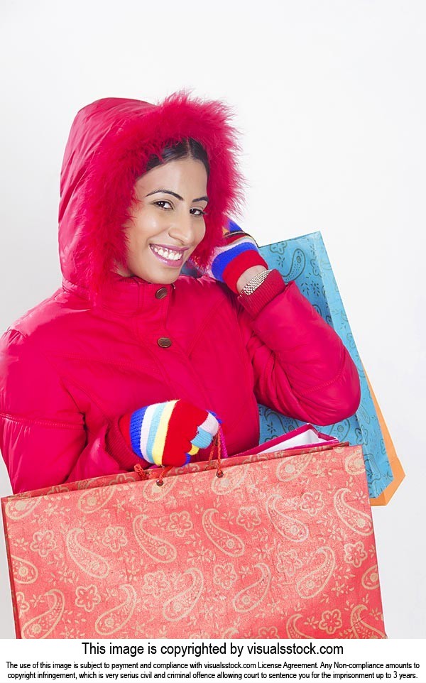 Indian Woman winter clothes shopping bags Smiling
