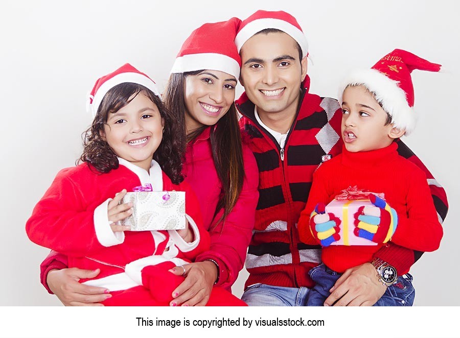 Indian Family Christmas Gifts Celebration Smiling