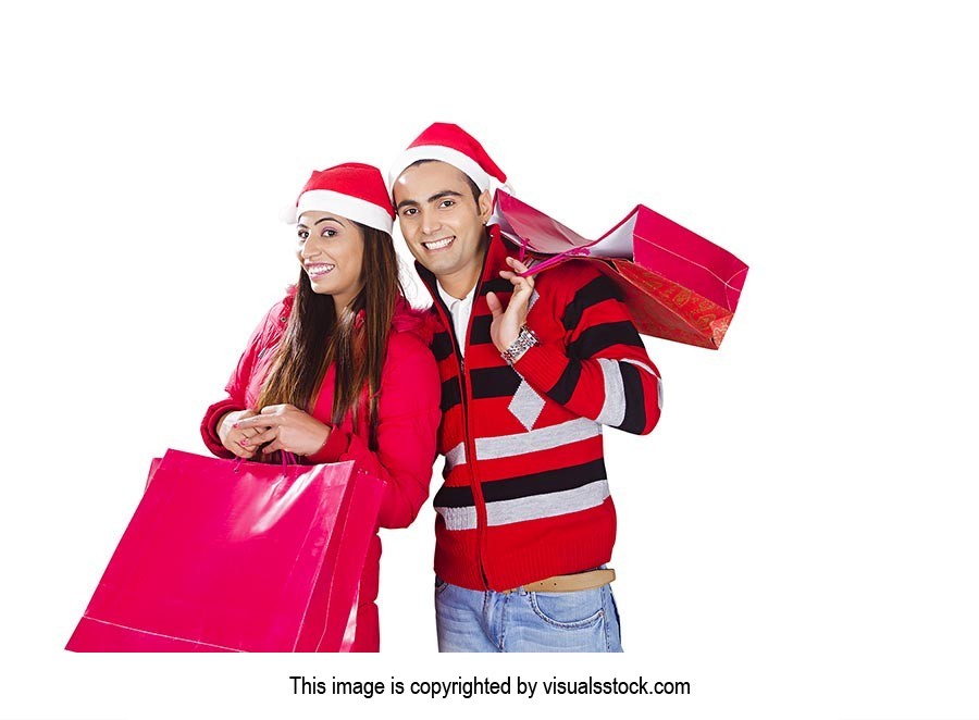 Indian Couple Christmas Winter Clothes Shopping Ba