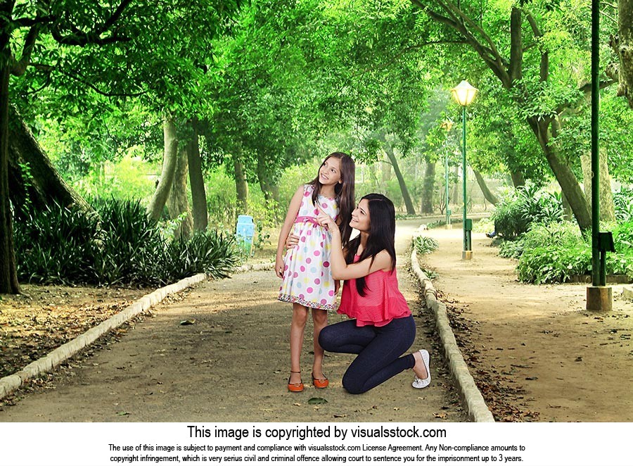 Mother Daughter Park Sitting Pointing