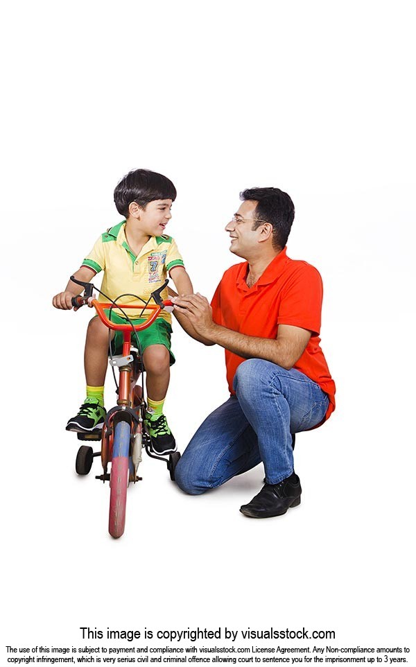 Father Teaching Son Ride Bicycle