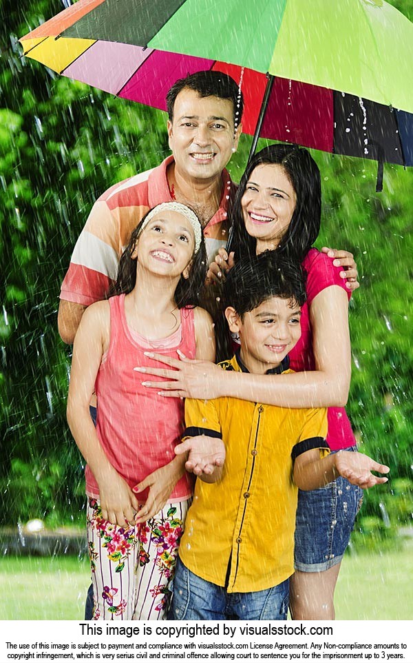 Family Enjoying Rain Park