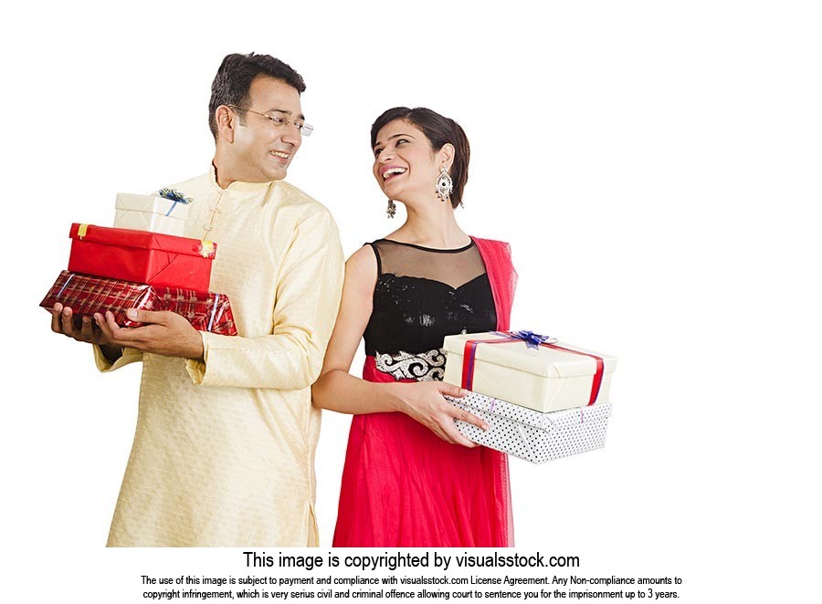 Couple Holding Gift Boxes Diwali Celebration