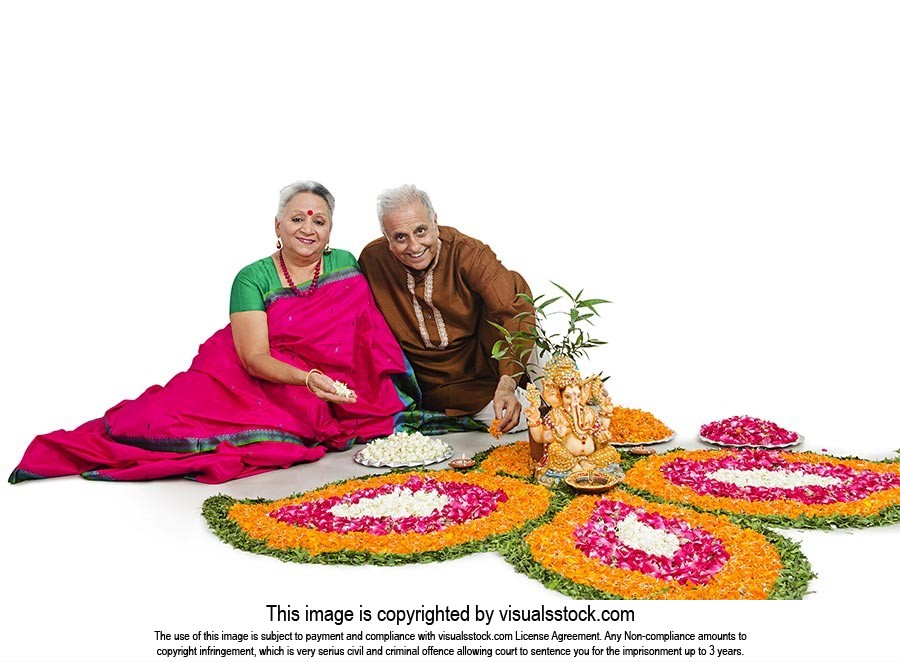 Senior Couple  Decorating Rangoli Diwali