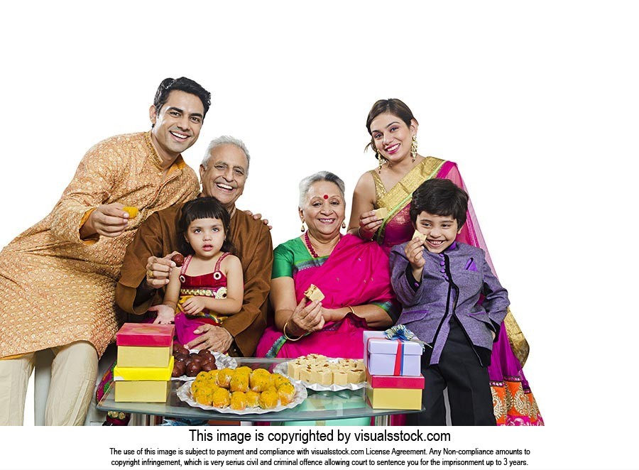 Indian Family Diwali Giving Sweets