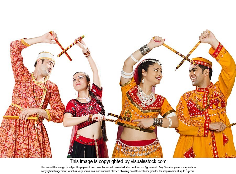 Indian Couples Performing Dandiya Navratri Celebra