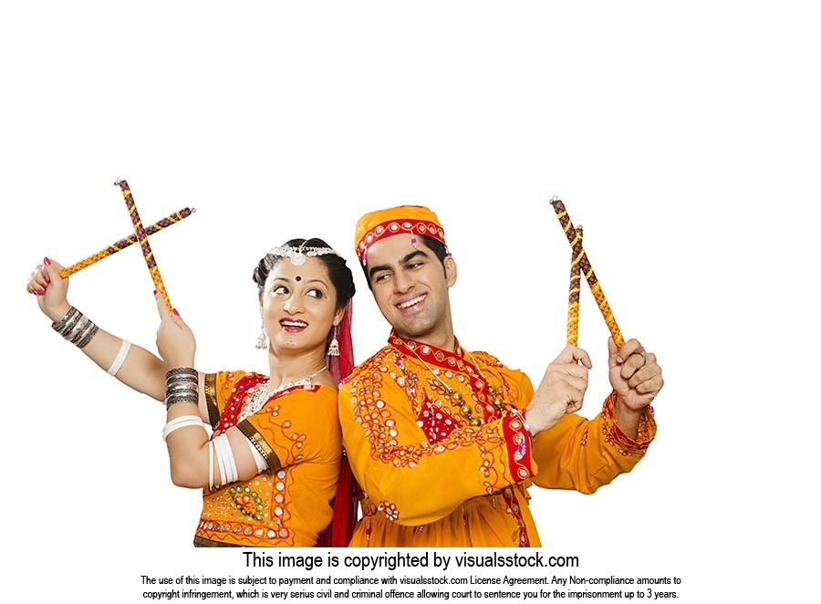 Indian Gujarati Couple Performing Dandiya Dance