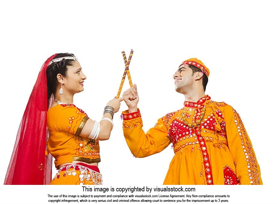 Gujarati Couple Dancer Performing Dandiya Dance