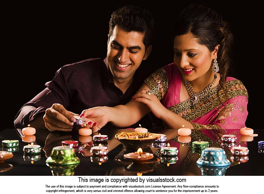 Diwali Festival Married Couple Lighting Diyas