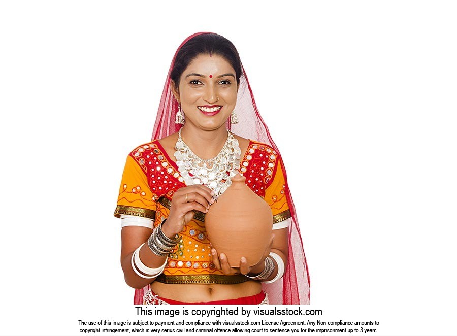 Gujrati Woman Inserting Coin Piggybank