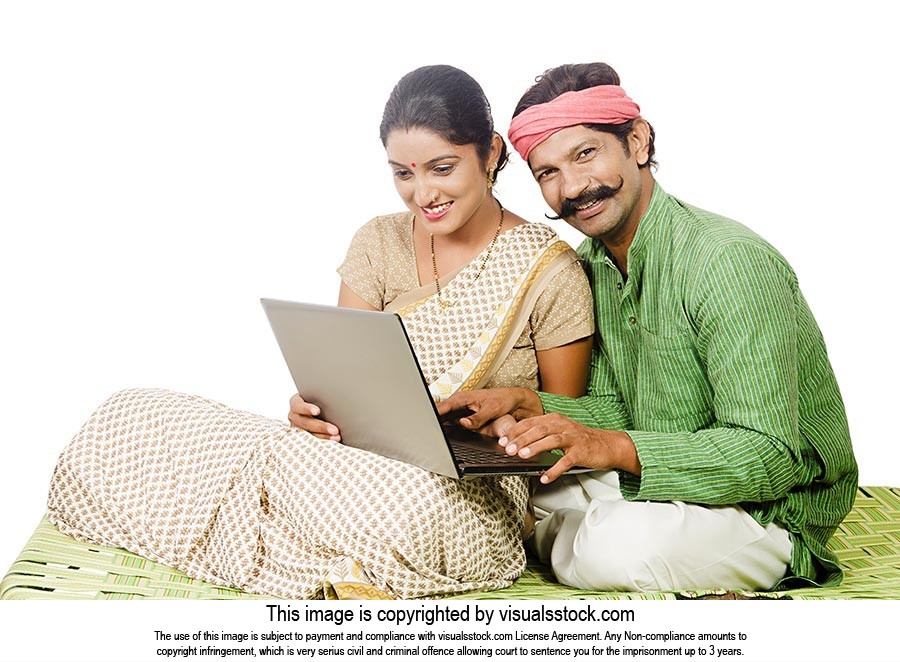 Indian Rural Couple Using Laptop