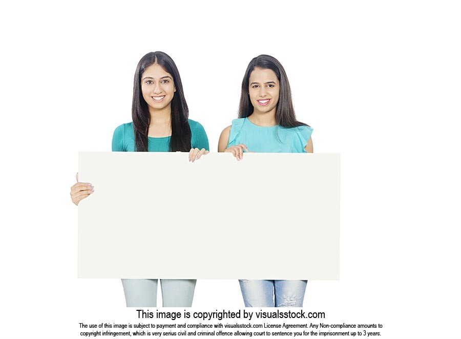 Teenage Girls Holding White board