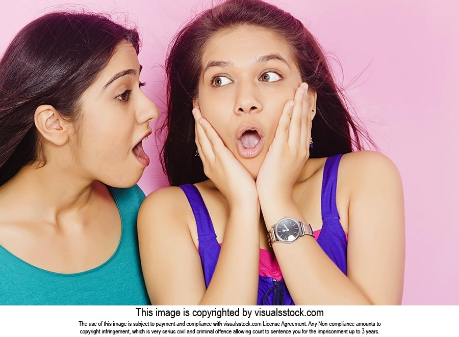 Girl Telling Secret Shocked Sister