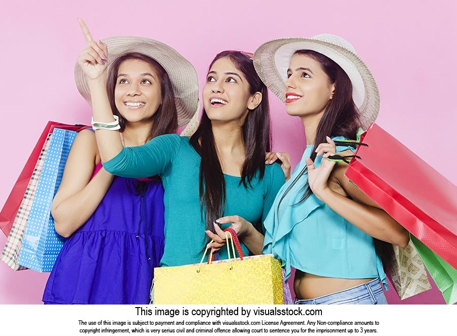 Teenage Girls Shopping Bag Pointing