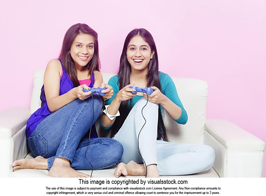 Girls Sisters Playing Video games