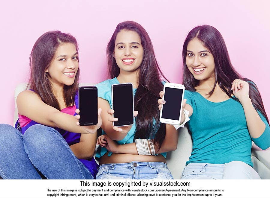Teenage Girls Showing Phone