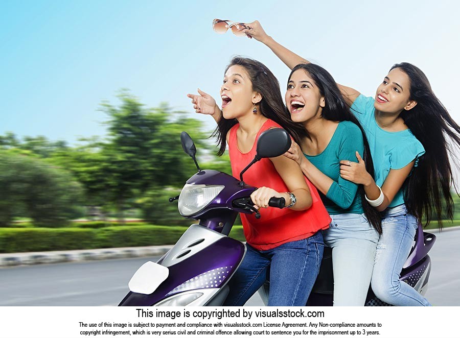 Teenage Girls Riding Scooty Speed