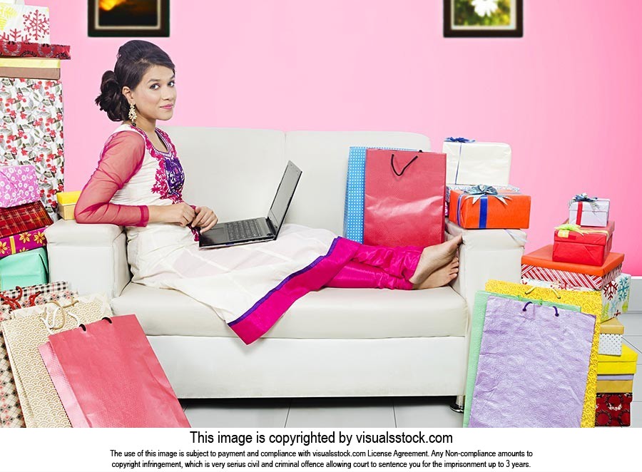 Young Woman Diwali Shopping Laptop