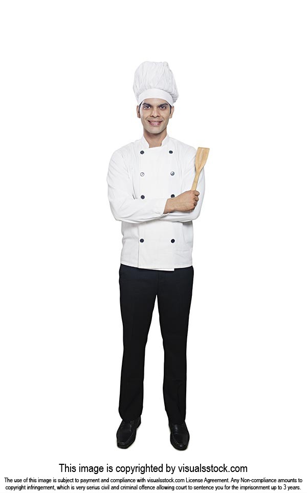 Smiling Professional Chef Standing Holding Spatula
