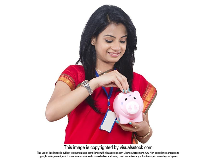 Businesswoman Inserting Money Piggybank