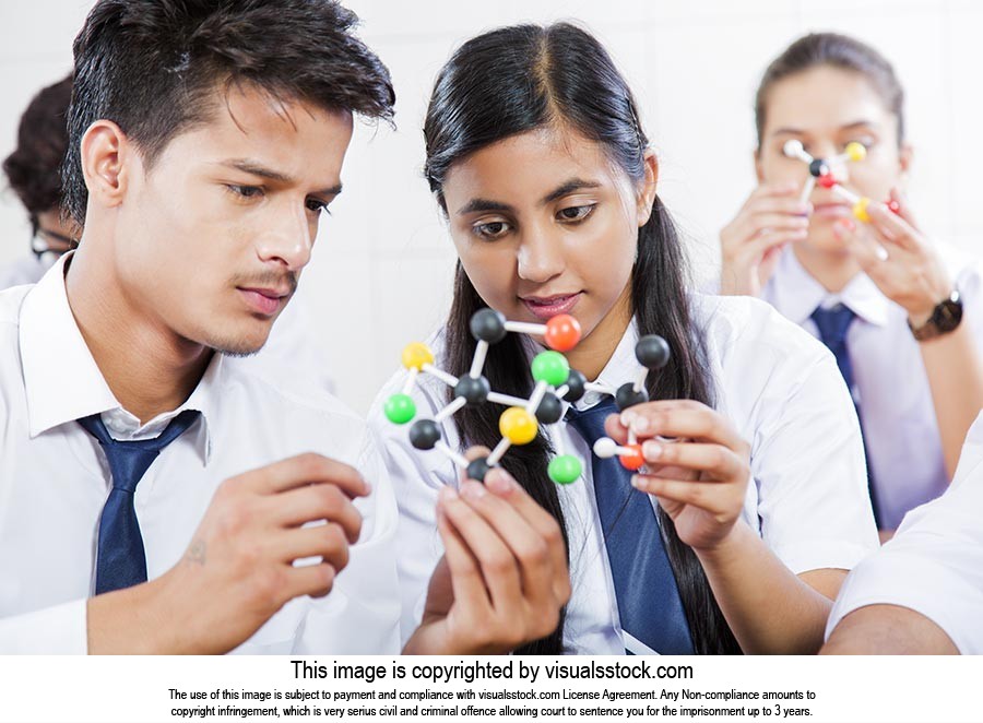 School Students Examining Atom