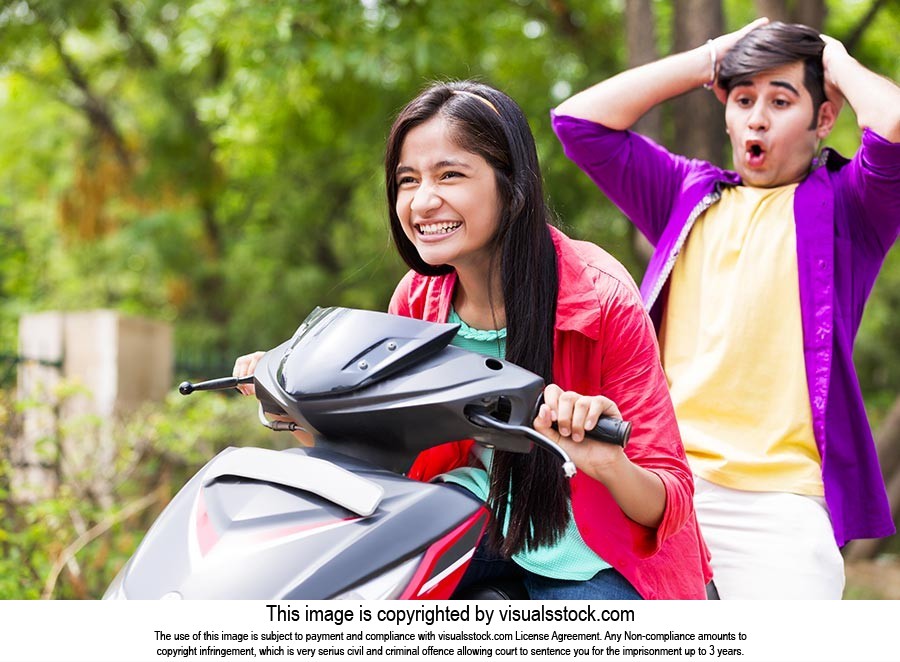 Teenagers Couple Riding Scooty
