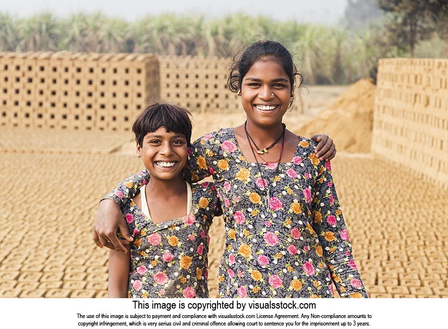 Indian Rural Kids Girls Arm Around Standing In Brick -Factory Village