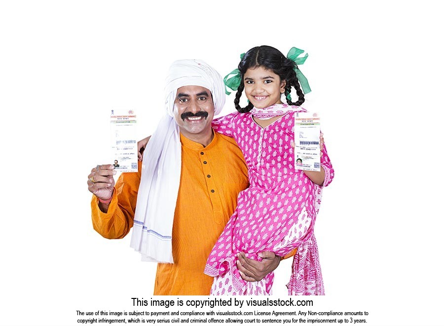Indian Rural Father And Little Daughter Showing Aadhar Card Government  Identity