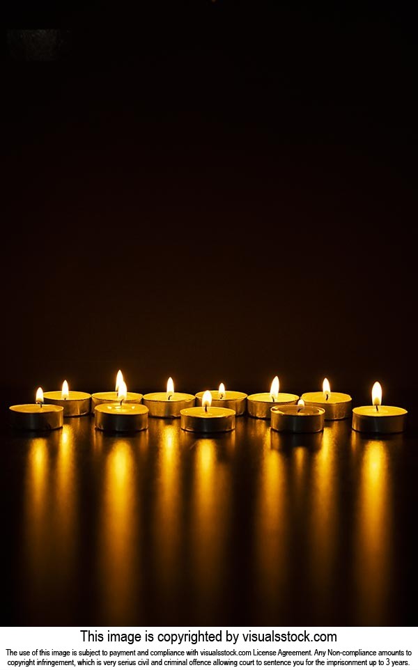Indian Festival Diwali Burning Tealights Candles Lighting Illuminated  on-Black background