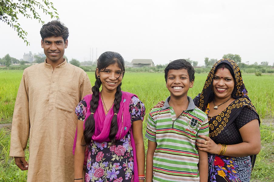 Happy Farmer-Family Parents And Two-Children Standing together At-Farm ...