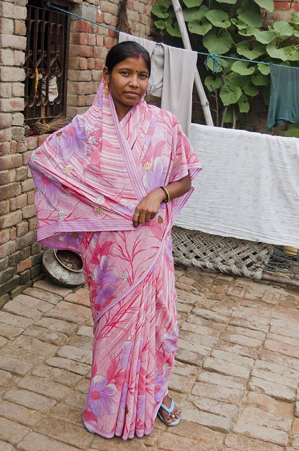 Rural Woman Villager standing outside her-house Village Uttar Pradesh India