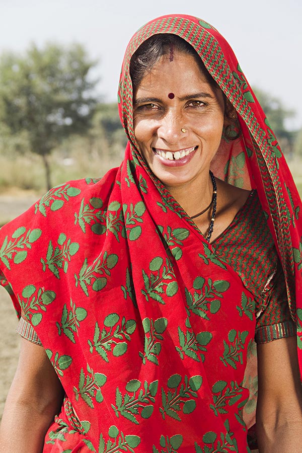 Smiling Indian Rural Farmer Woman Housewife Standing In Farm Village