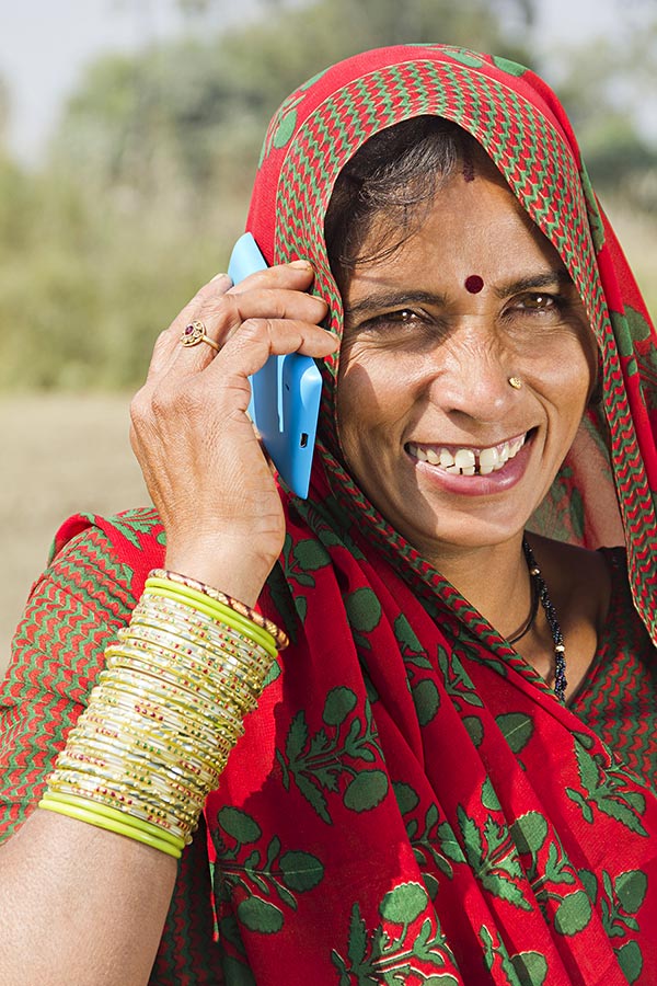 Close-Up Indian Rural Villager Woman Talking On Mobile Phone Field