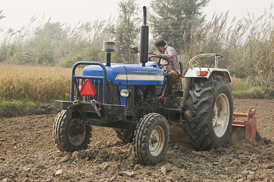 1 Indian Farmer Man Driving Tractor Field