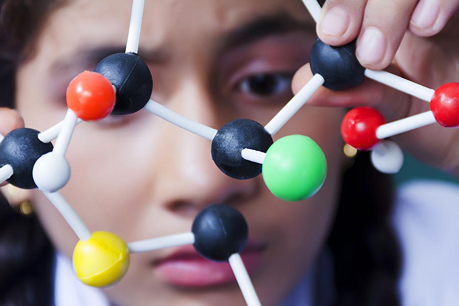 School Girl student studying molecular structure Atom In-Science Laboratory