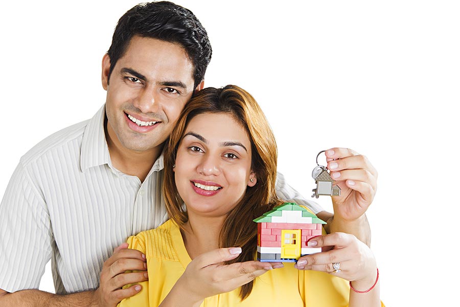 2 Indian Couple Showing Dummy House With Key Real Estate