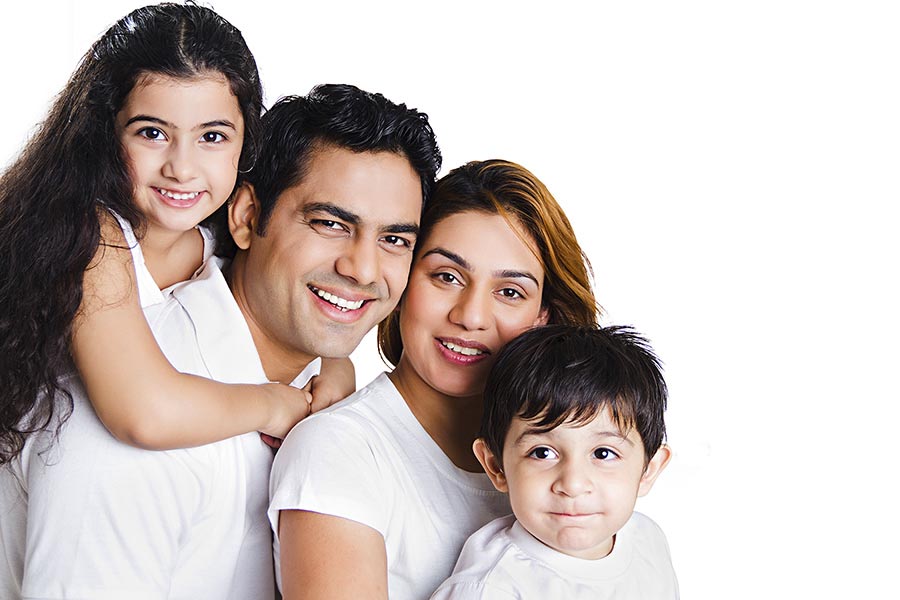 Happy Indian Family Parents And Children Sitting Together Queue s Enjoying