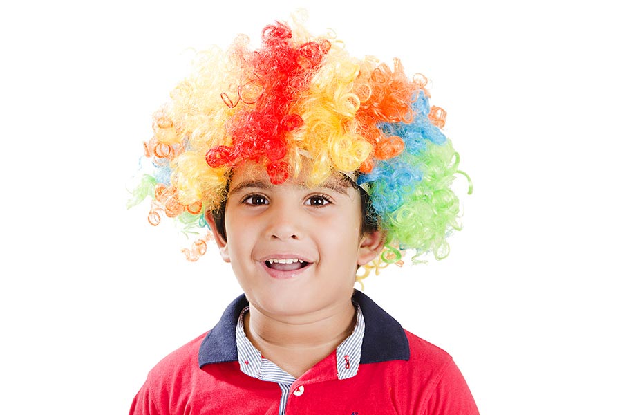 Close-up Happy Cute kid-Boy wearing colorful-wig Having Fun Enjoying