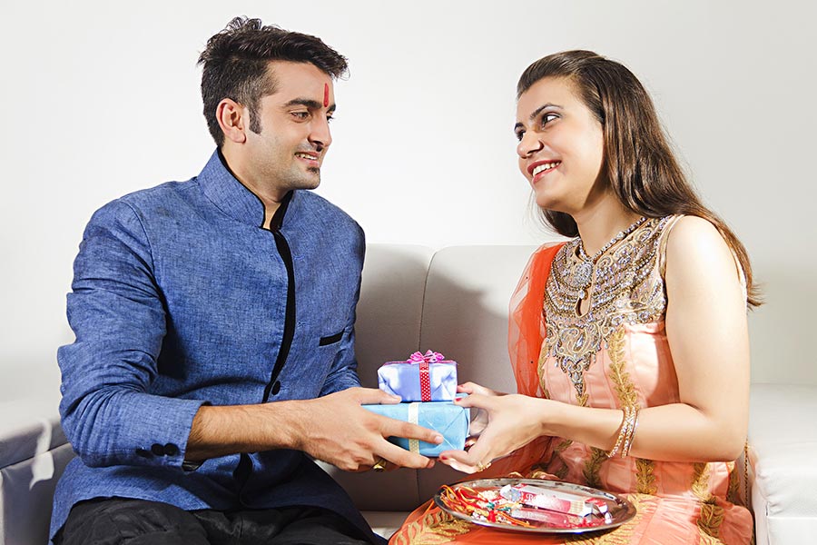 brother-giving-gift-to-her-sister-during-raksha-bandhan-festival