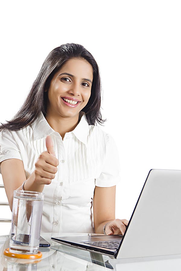 Indian Businesswoman Employee Using laptop While Showing Thumbs-up In ...