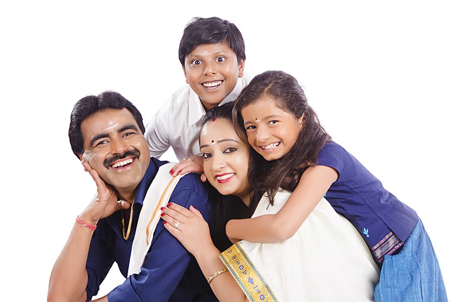 Happy South Indian family together having fun enjoying on-white Background