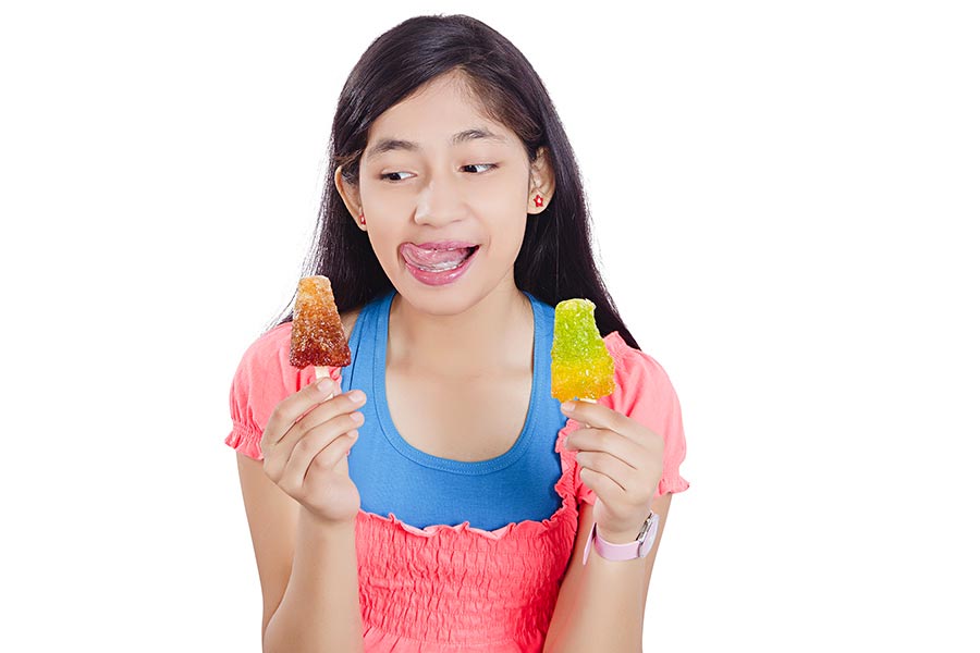 Happy Young-Girl Holding Candy Crush Gola Ice-Gola Mouth Watering ...