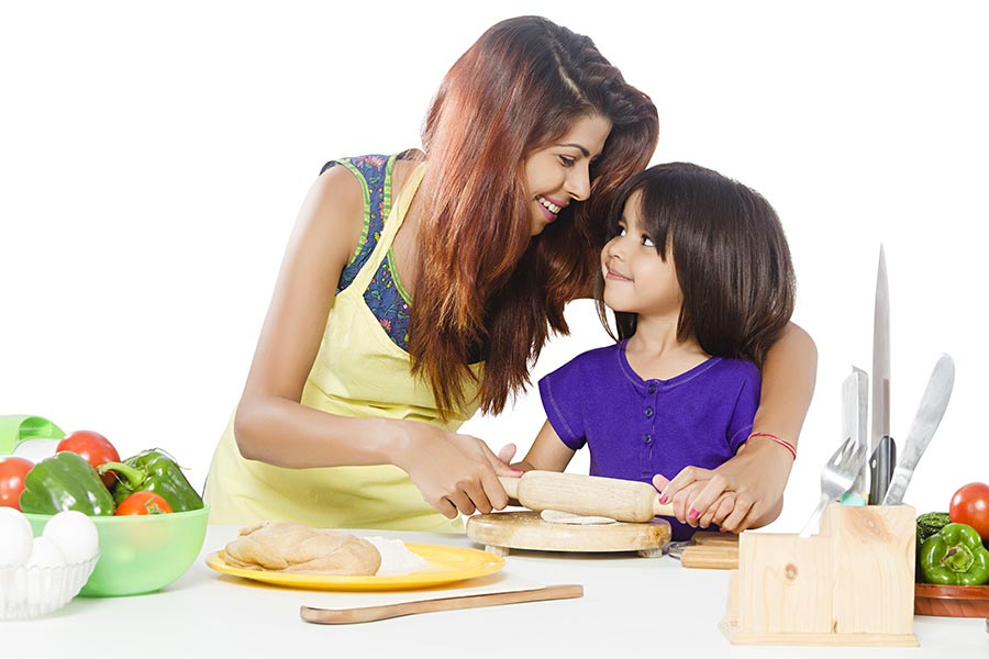 Indian Mother Cooking With Her Daughters At Kitchen Stock Photo, Picture  and Royalty Free Image. Image 47178741.